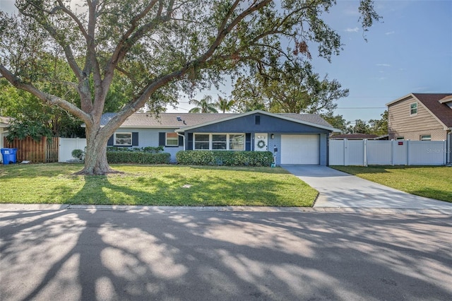 ranch-style house with a garage and a front yard