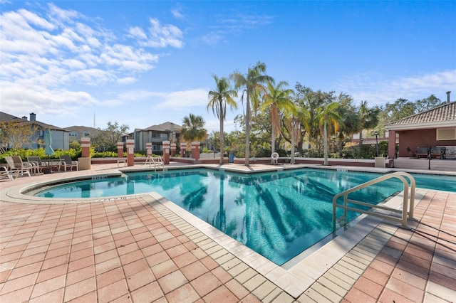 view of swimming pool featuring a patio area