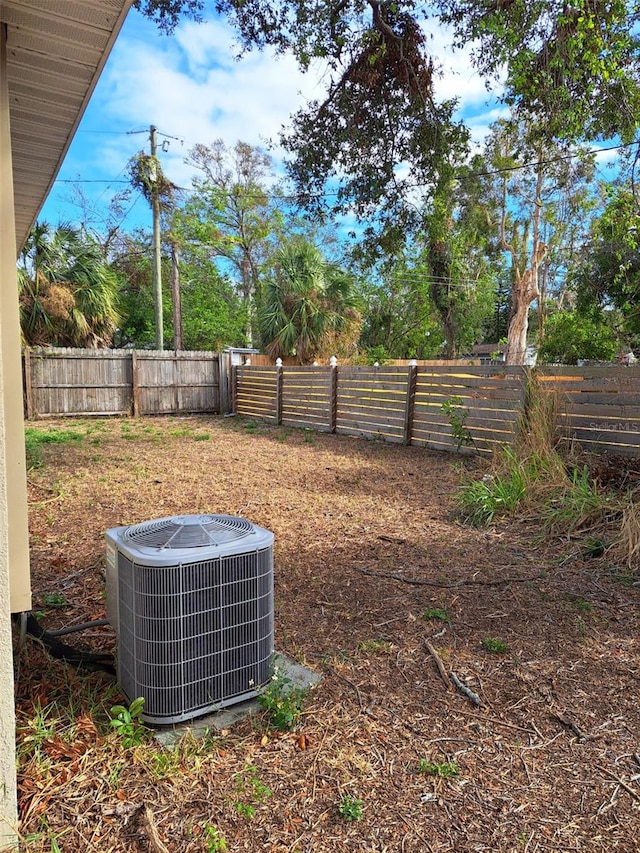 view of yard featuring central air condition unit