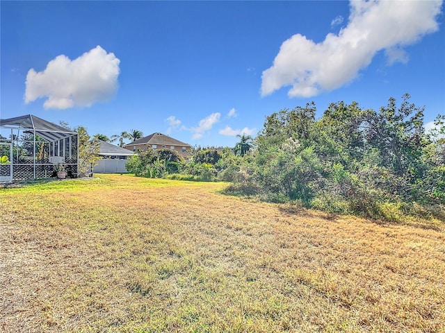 view of yard featuring a lanai