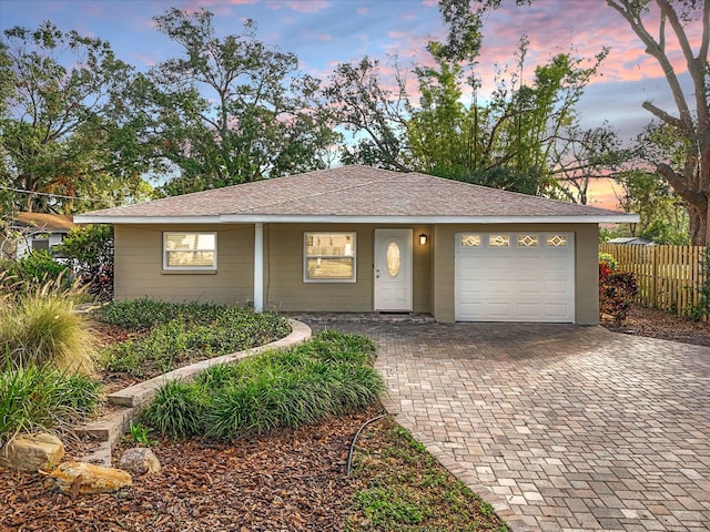 ranch-style house featuring a garage