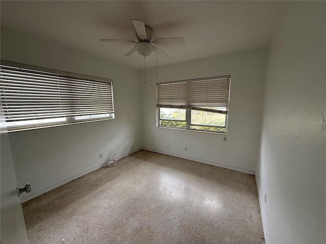 unfurnished room featuring ceiling fan