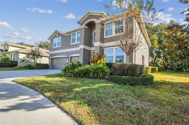 view of front of home featuring a garage and a front yard