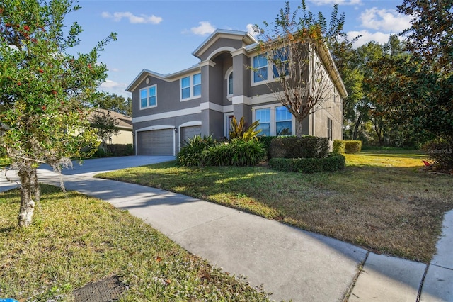 view of front of property with a garage and a front yard