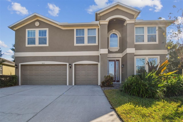 2212 Valterra Vista Way, Valrico, FL 33594 - view of front of property featuring stucco siding, concrete driveway, and an attached garage