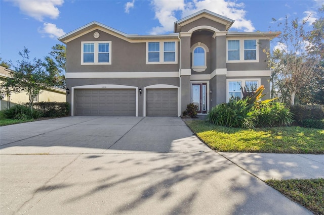 view of front of property with a garage