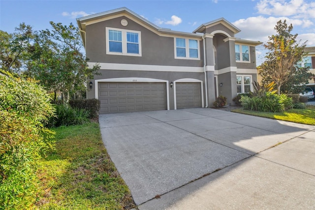 2212 Valterra Vista Way, Valrico, FL 33594 - traditional-style house with stucco siding, driveway, and an attached garage
