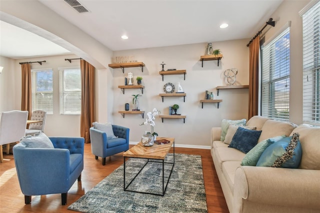 living area with hardwood / wood-style flooring