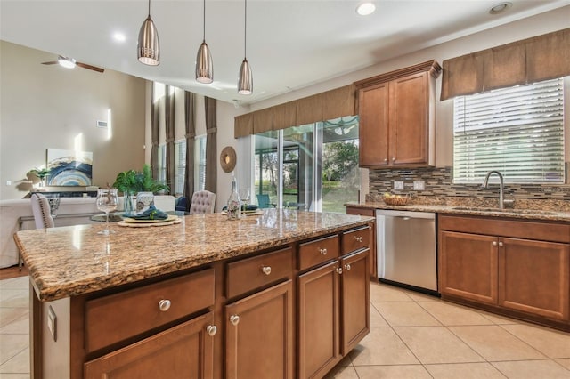 2212 Valterra Vista Way, Valrico, FL 33594 - kitchen featuring stainless steel dishwasher, light tile patterned floors, a center island, light stone countertops, and recessed lighting