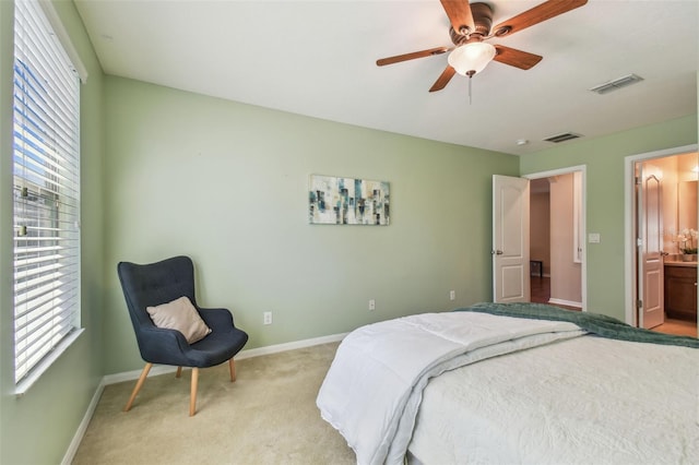 2212 Valterra Vista Way, Valrico, FL 33594 - bedroom with light carpet, a ceiling fan, and ensuite bath