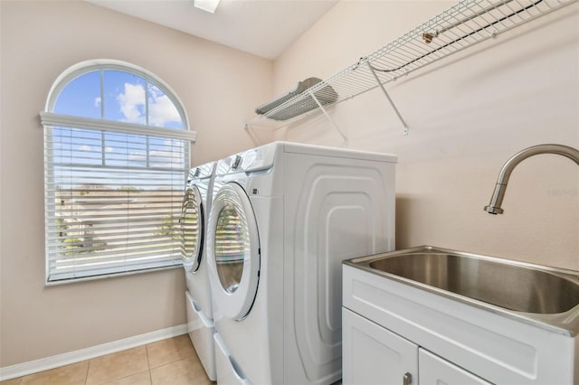 2212 Valterra Vista Way, Valrico, FL 33594 - laundry area with cabinet space, washer and dryer, and light tile patterned floors