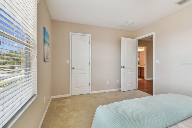 bedroom featuring light colored carpet