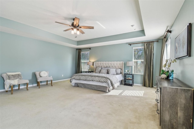 2212 Valterra Vista Way, Valrico, FL 33594 - bedroom featuring light carpet, a raised ceiling, and ceiling fan