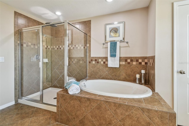 2212 Valterra Vista Way, Valrico, FL 33594 - bathroom featuring a bath, a stall shower, tile patterned floors, and recessed lighting