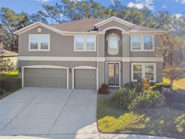 2212 Valterra Vista Way, Valrico, FL 33594 - view of front of home with stucco siding, driveway, and an attached garage