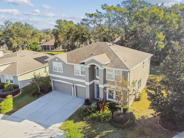 view of front of house featuring a garage and a front yard