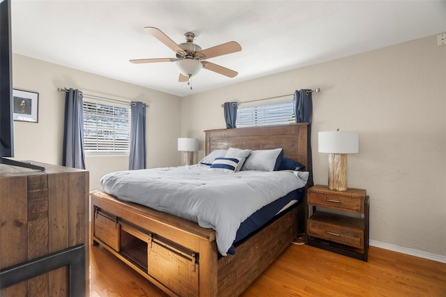 bedroom featuring ceiling fan and light hardwood / wood-style flooring