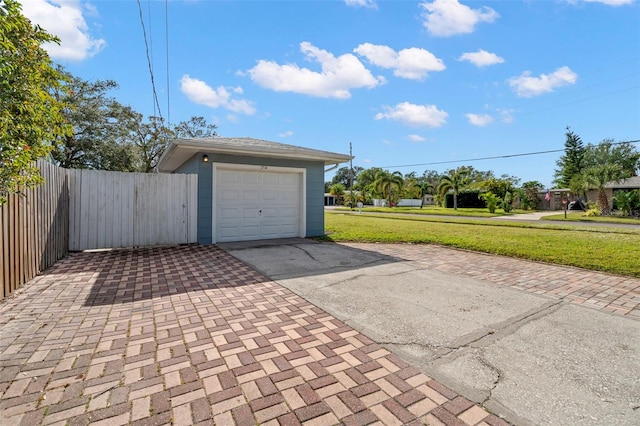 garage with a yard