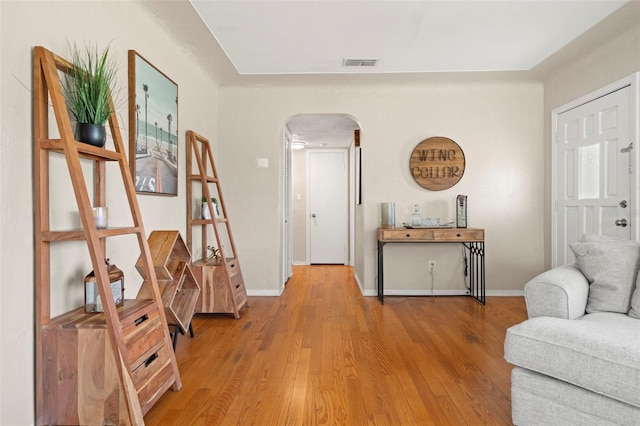 sitting room with hardwood / wood-style floors