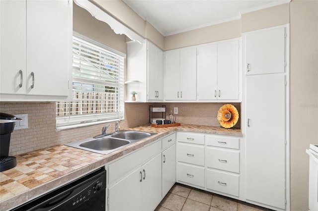 kitchen with sink, light tile patterned floors, dishwasher, tasteful backsplash, and white cabinets