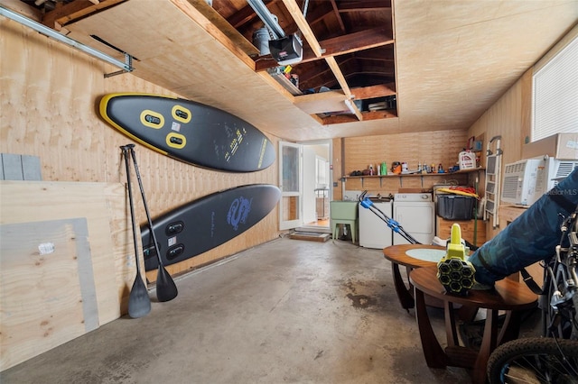 garage featuring sink and wooden walls