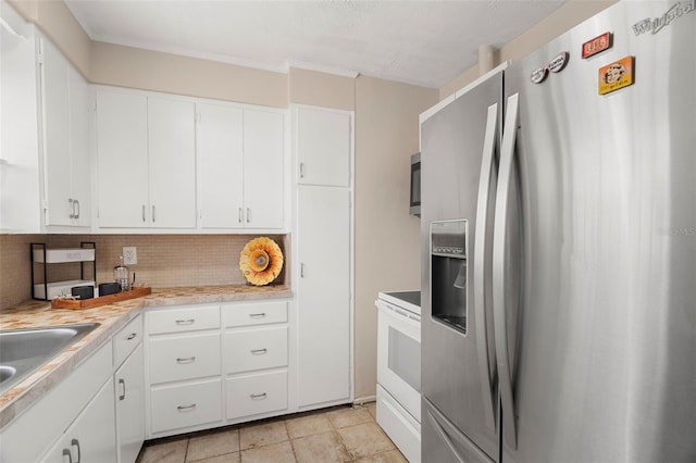 kitchen featuring sink, white cabinetry, tasteful backsplash, stainless steel fridge with ice dispenser, and electric stove