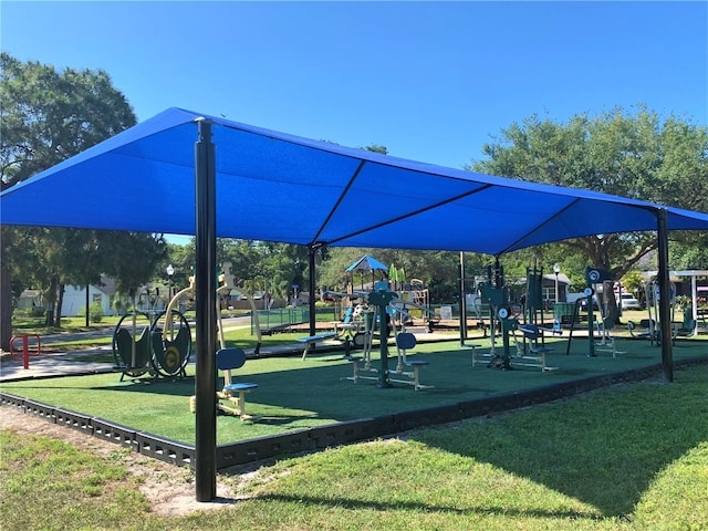 surrounding community featuring a playground and a lawn