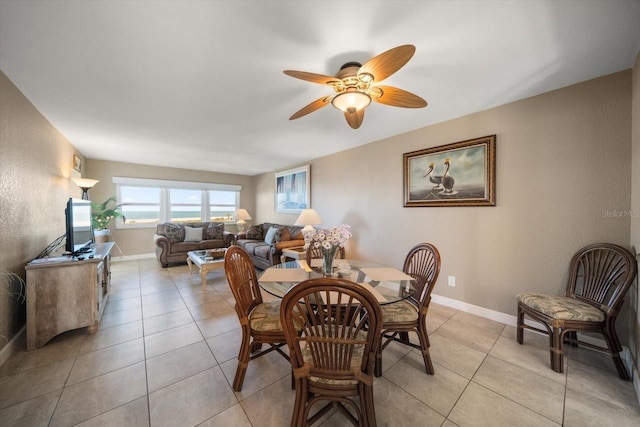 dining room featuring ceiling fan and light tile patterned floors