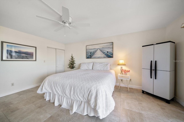 bedroom with ceiling fan and a closet