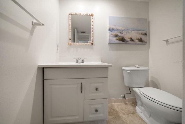 bathroom with tile patterned floors, vanity, and toilet