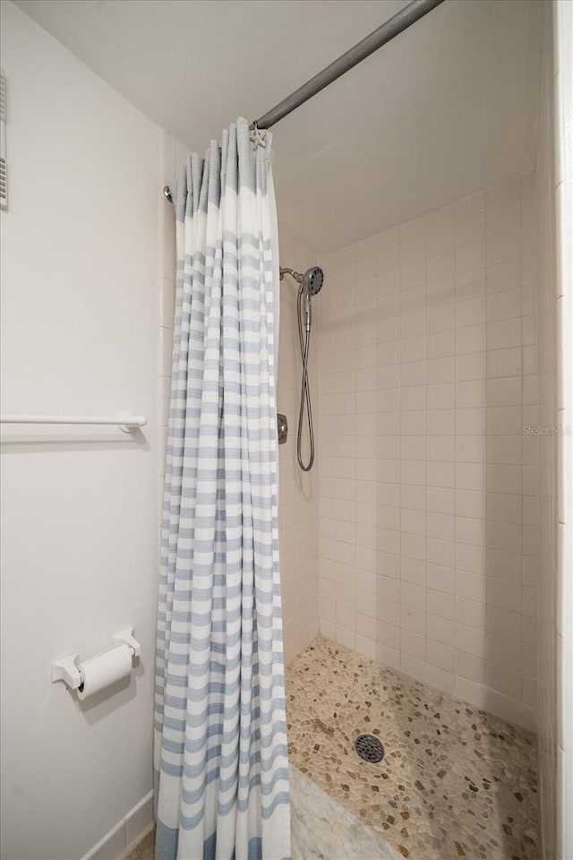 bathroom with a shower with curtain