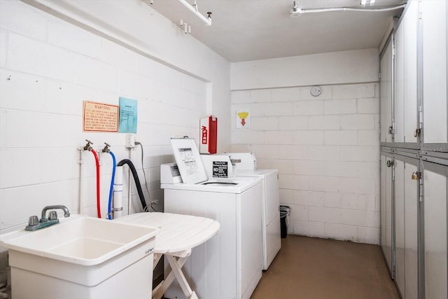 laundry area with sink and washer and dryer