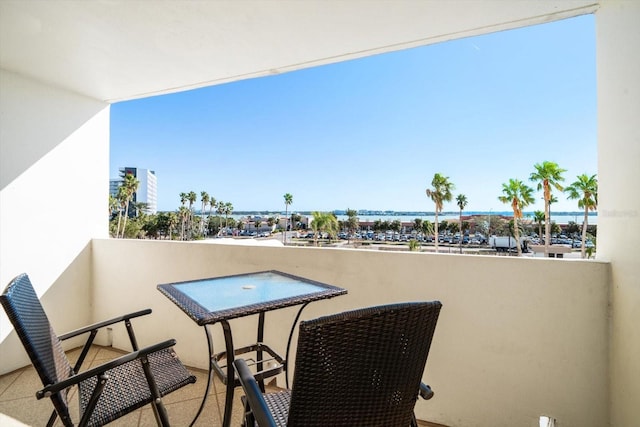 balcony featuring a water view