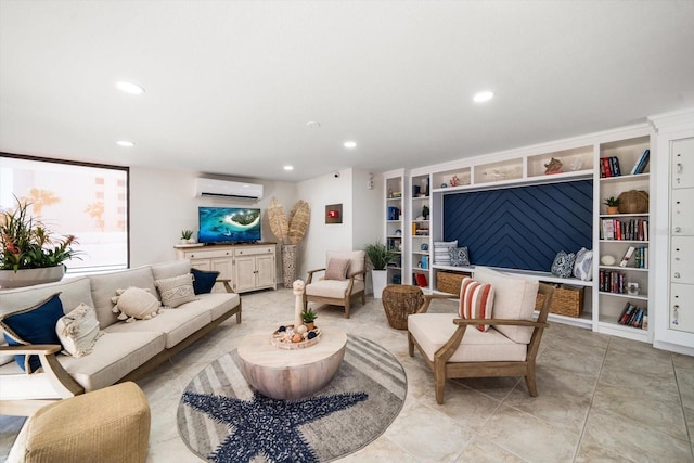 living room featuring light tile patterned floors and an AC wall unit