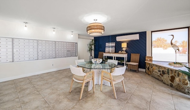 dining space featuring mail boxes and an AC wall unit