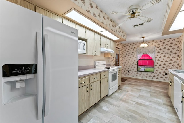 kitchen featuring pendant lighting, ceiling fan, and white appliances