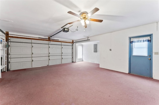 garage with ceiling fan, a garage door opener, and electric panel