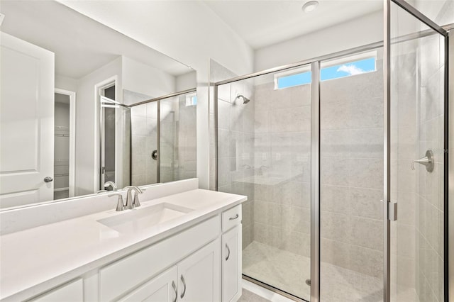 full bath featuring a stall shower and vanity