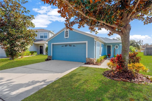 view of front of property with a front yard and a garage