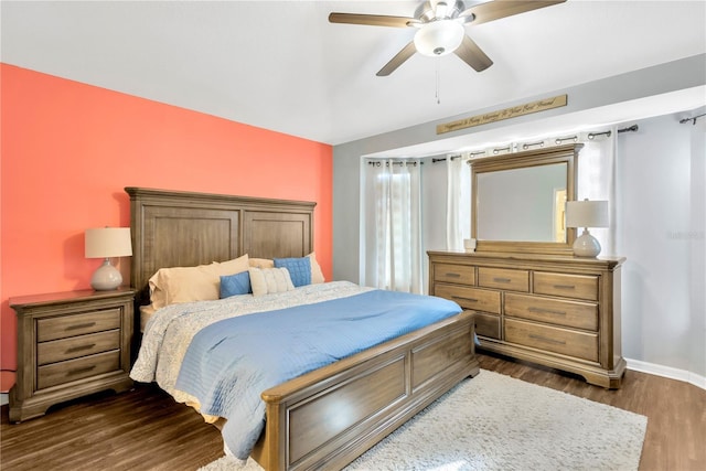 bedroom featuring ceiling fan and dark wood-type flooring