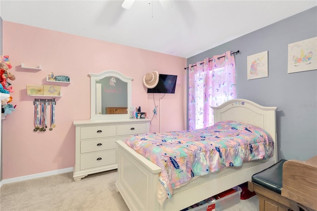 bedroom with ceiling fan and light carpet