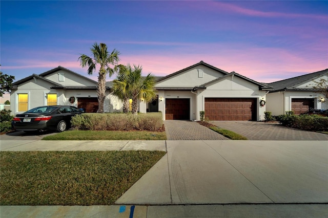 ranch-style home featuring a garage