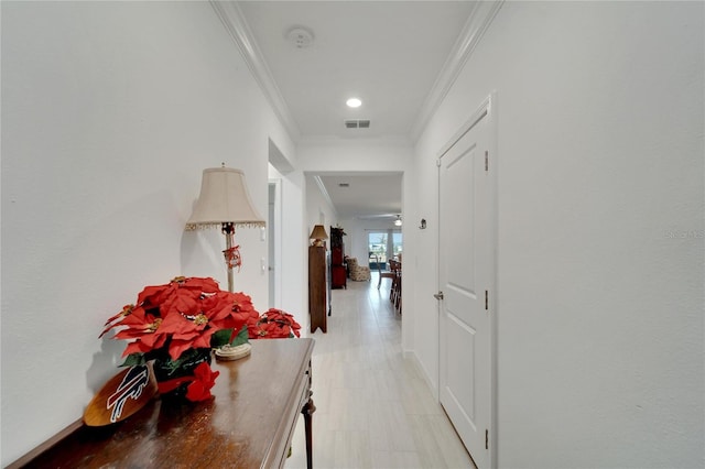 hallway featuring ornamental molding