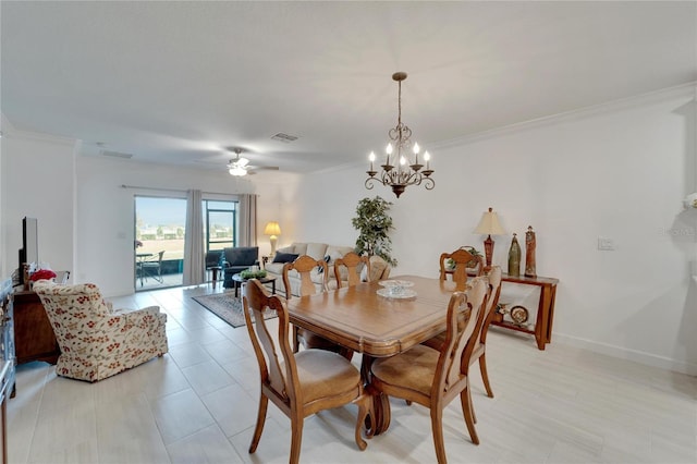 dining room with ceiling fan with notable chandelier and ornamental molding