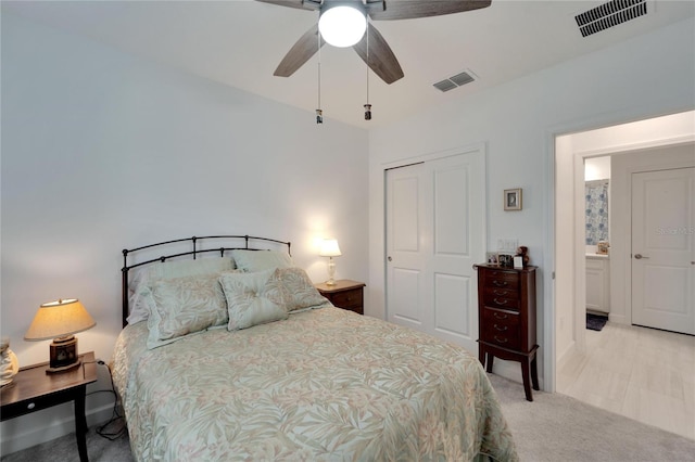 carpeted bedroom with a closet and ceiling fan