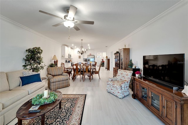 living room with ceiling fan with notable chandelier and crown molding