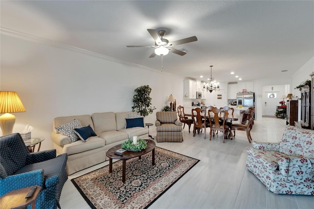 living room featuring ceiling fan with notable chandelier and ornamental molding