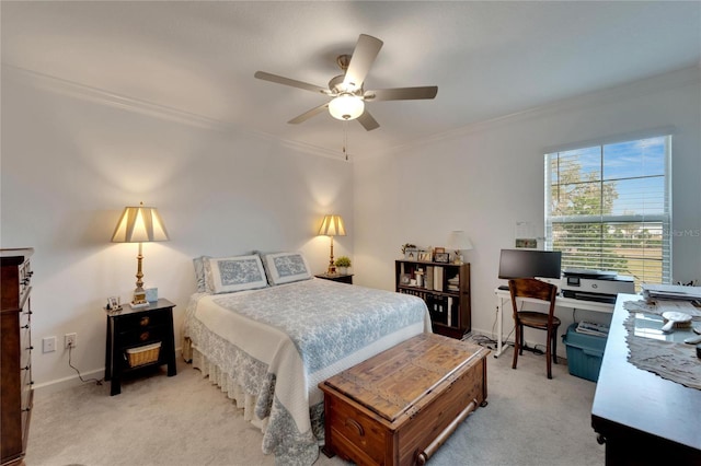 bedroom featuring ceiling fan, ornamental molding, and light carpet