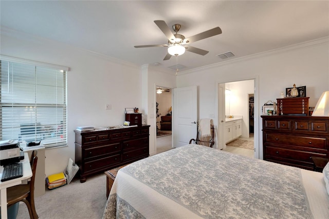 bedroom with ensuite bath, ceiling fan, crown molding, and light colored carpet