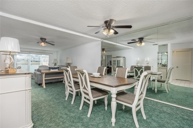 dining area featuring carpet and a textured ceiling